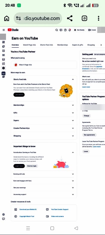 YouTube Studio Earn page on mobile showing You're a YouTube Partner with Watch Page Ads, Shorts Feed Ads, Memberships, Supers and Shopping
